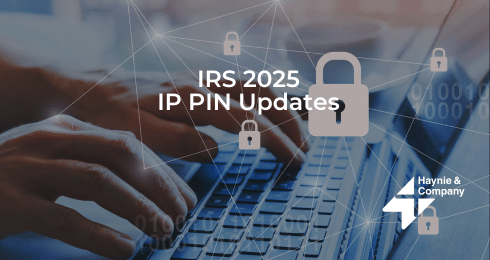 Hands typing on a laptop with text: IRS 2025 IP PIN Updates, locks symbolize cybersecurity, Haynie logo.