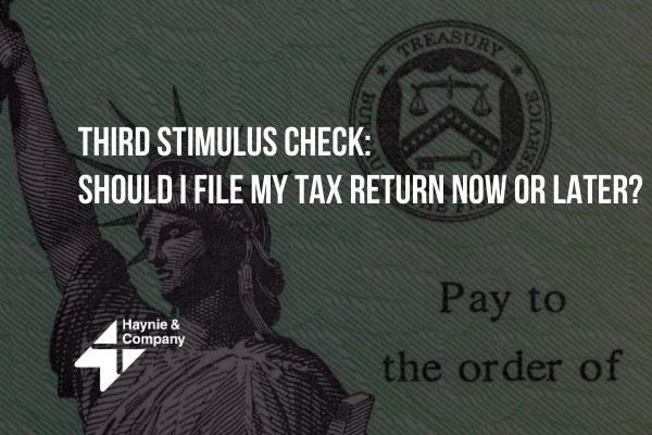 Third stimulus check question on tax returns with Statue of Liberty image.