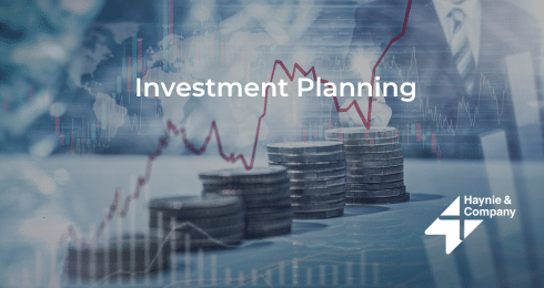 Investment planning concept with stacked coins and rising graph, Haynie logo.