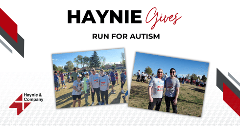 Group of people at Haynie Gives Run for Autism event in a park.