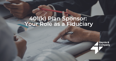 401(k) plan sponsor meeting with documents, discussing fiduciary responsibilities.