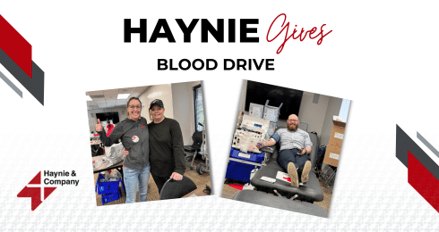Blood drive event by Haynie featuring participants donating blood.