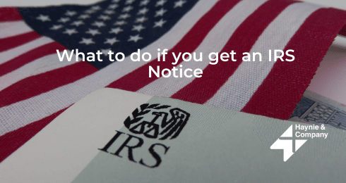 IRS notice document with American flag background.