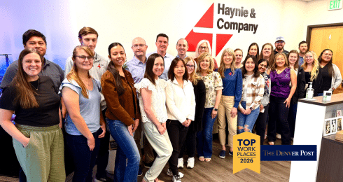 A group of people at Haynie celebrate being named a top workplace by The Denver Post in 2026.