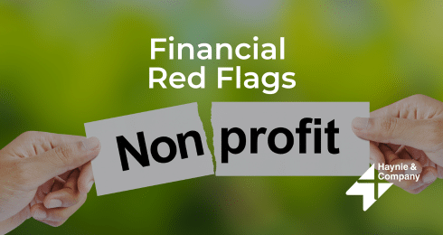 Financial Red Flags in Nonprofit Organizations, hands tearing paper