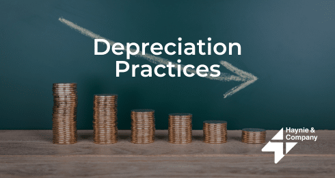Coins stacked with downward arrow and Depreciation Practices text, Haynie logo visible.