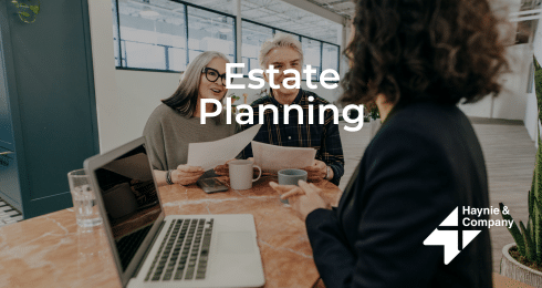 Couple meeting with an advisor for estate planning at Haynie office.