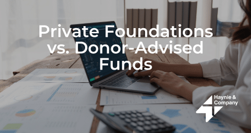 Person using laptop with graphs, exploring private foundations and donor-advised funds, Haynie branding.