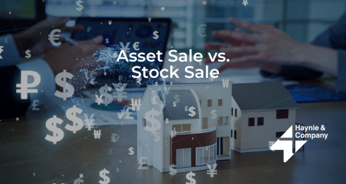 Asset Sale vs. Stock Sale concept with model buildings and currency symbols.