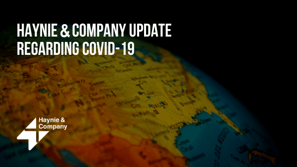 Haynie COVID-19 update text over a globe.