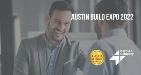 Austin Build Expo 2022: Two men in conversation, showcasing Gold Sponsorship by Haynie.