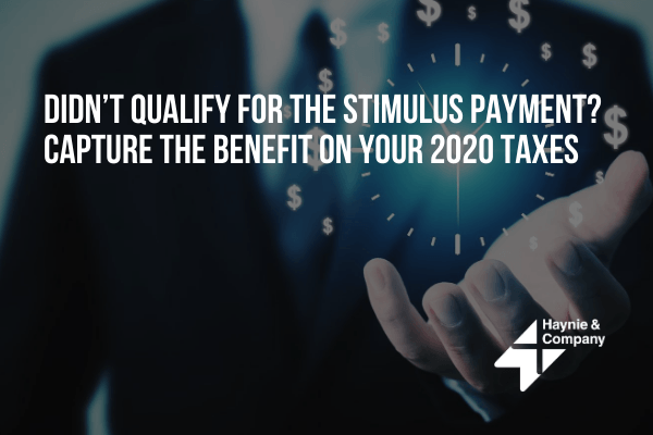 Businessman with open hand, promoting tips for capturing 2020 tax benefits related to unqualified stimulus payments.
