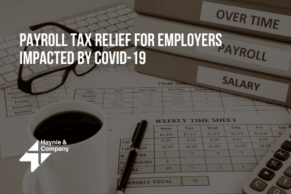 Payroll tax relief info for employers affected by COVID-19 with time sheet, coffee, and files.
