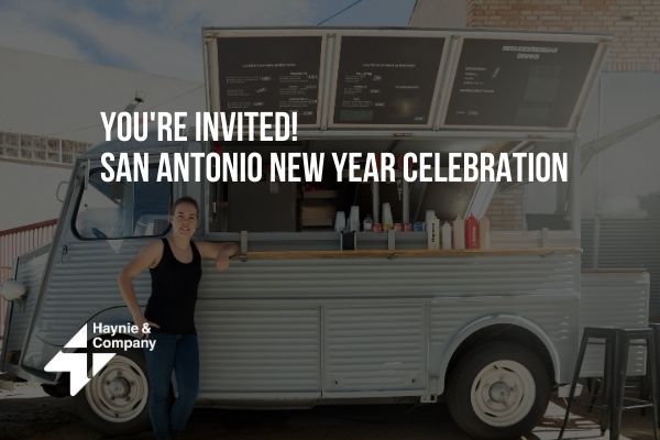 Food truck at San Antonio New Year Celebration with a woman standing, Haynie logo visible.