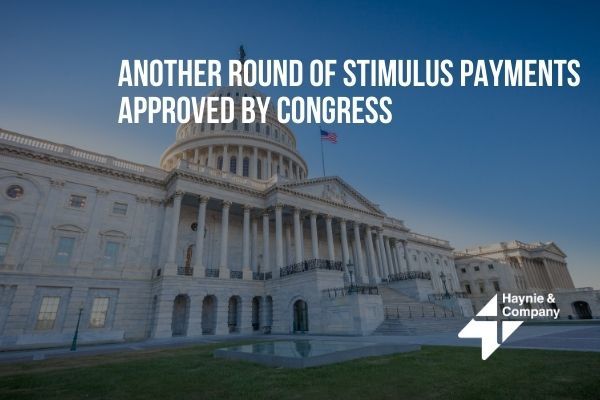 US Capitol building with text about Congress approving another round of stimulus payments.