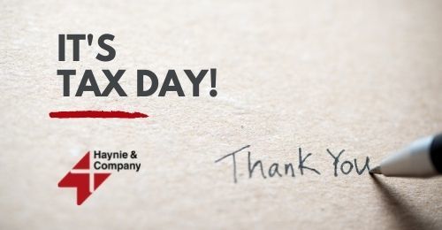It's Tax Day message with handwritten Thank You and Haynie logo on paper.