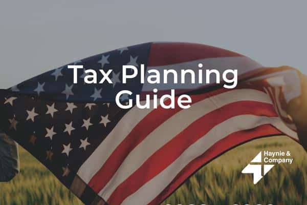Tax Planning Guide text over a waving American flag with Haynie logo.